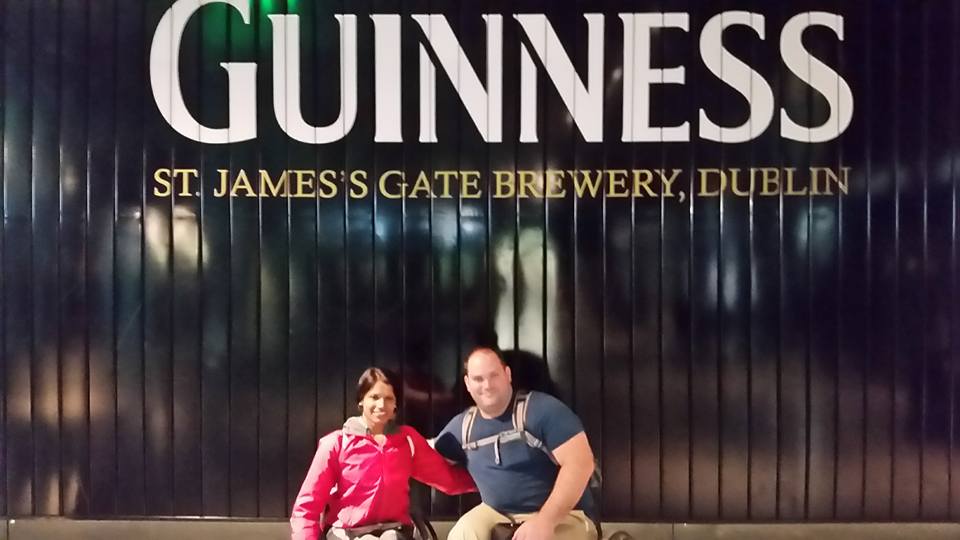 Maggie and Abe posing in front of Guinness Storehouse sign - St. James's Gate Brewery, Dublin