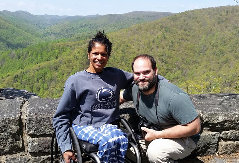 Maggie and Abe with mountains behind them.