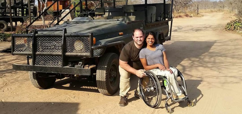 Maggie and Abe in front of safari vehicle.